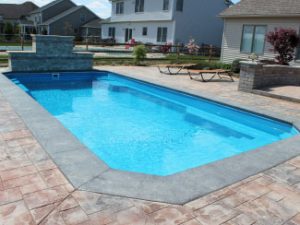 Fiberglass Pool with Stone Walll